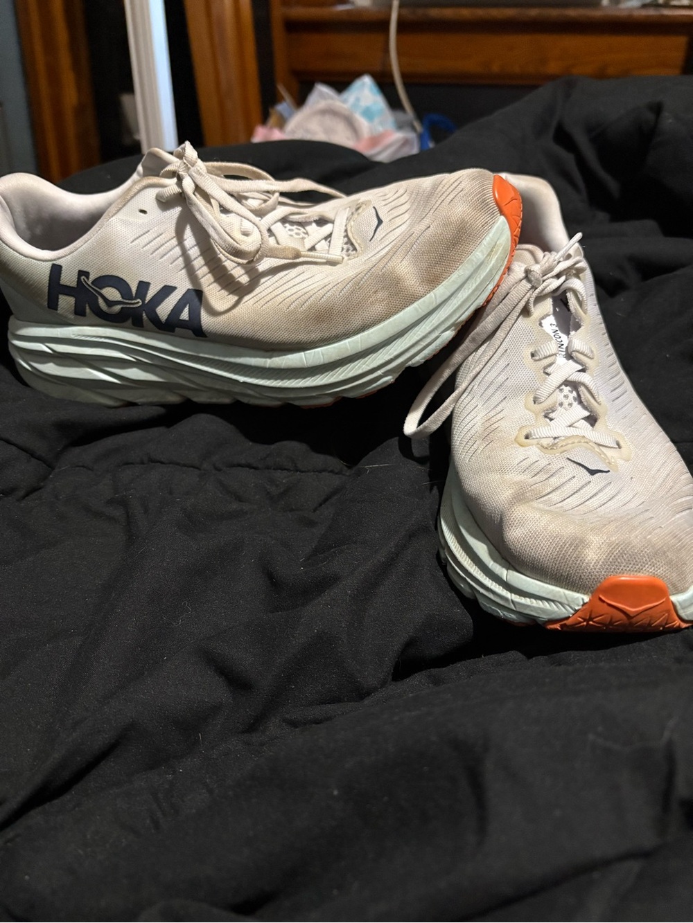 Hoka Women's Athletic Shoes in grey with Orange Accents and Navy Logo